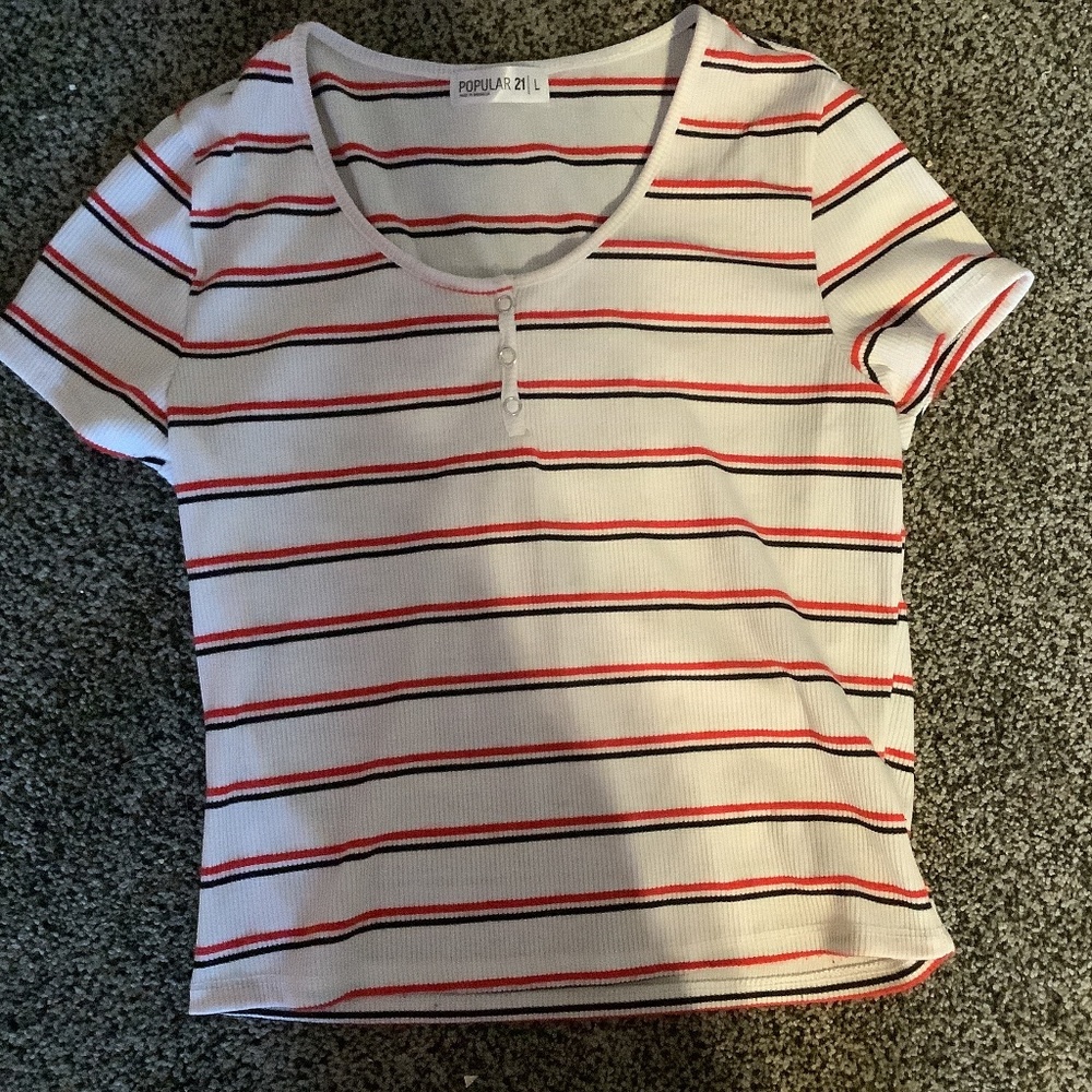 Slightly cropped buttoned baby tee with black and red stripes.